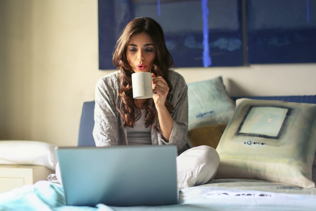 work from home women on bed